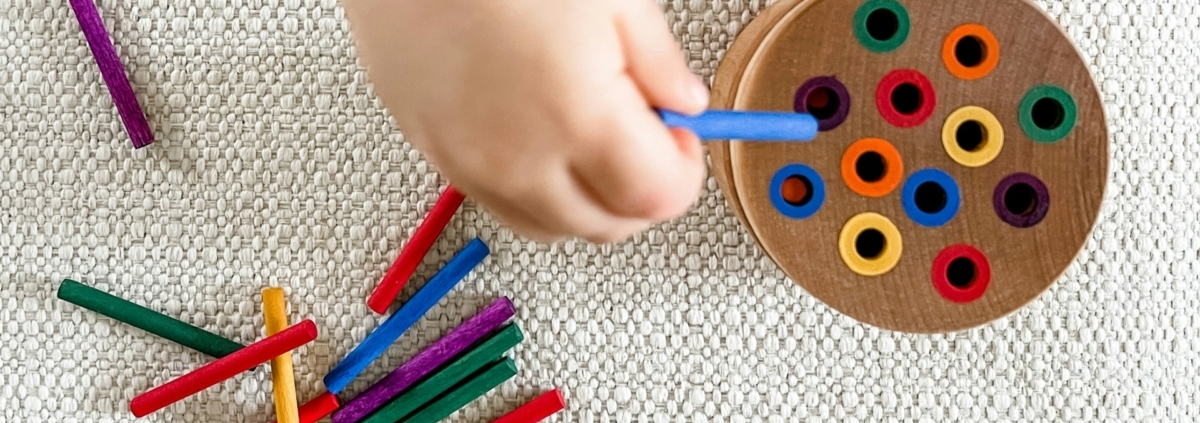 child playing with colour crayons at blue gum montessori school in perth