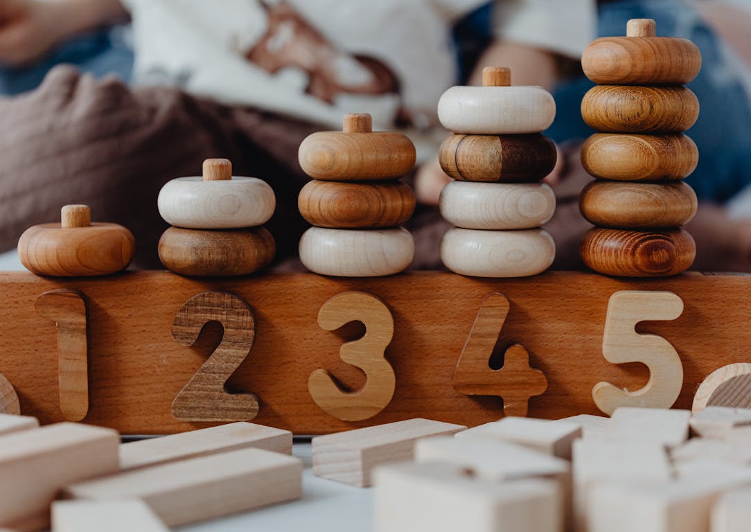 Close-up of wooden number stacking toy promoting creativity and learning in children.
