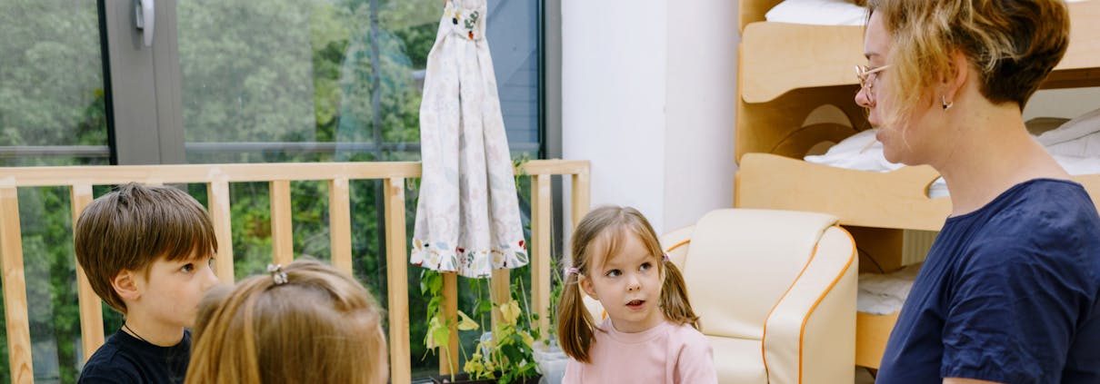 Teacher interacting with children at a montessori school