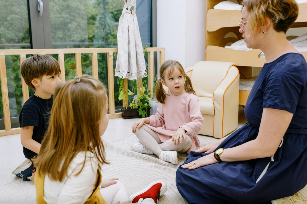 Teacher interacting with children at a montessori school